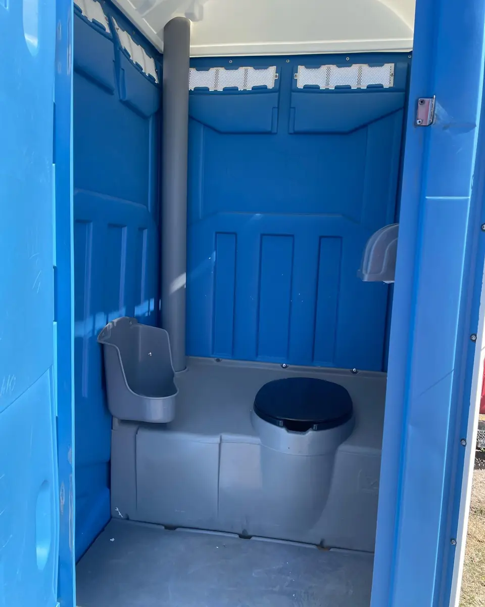 Standard porta potty interior with urinal